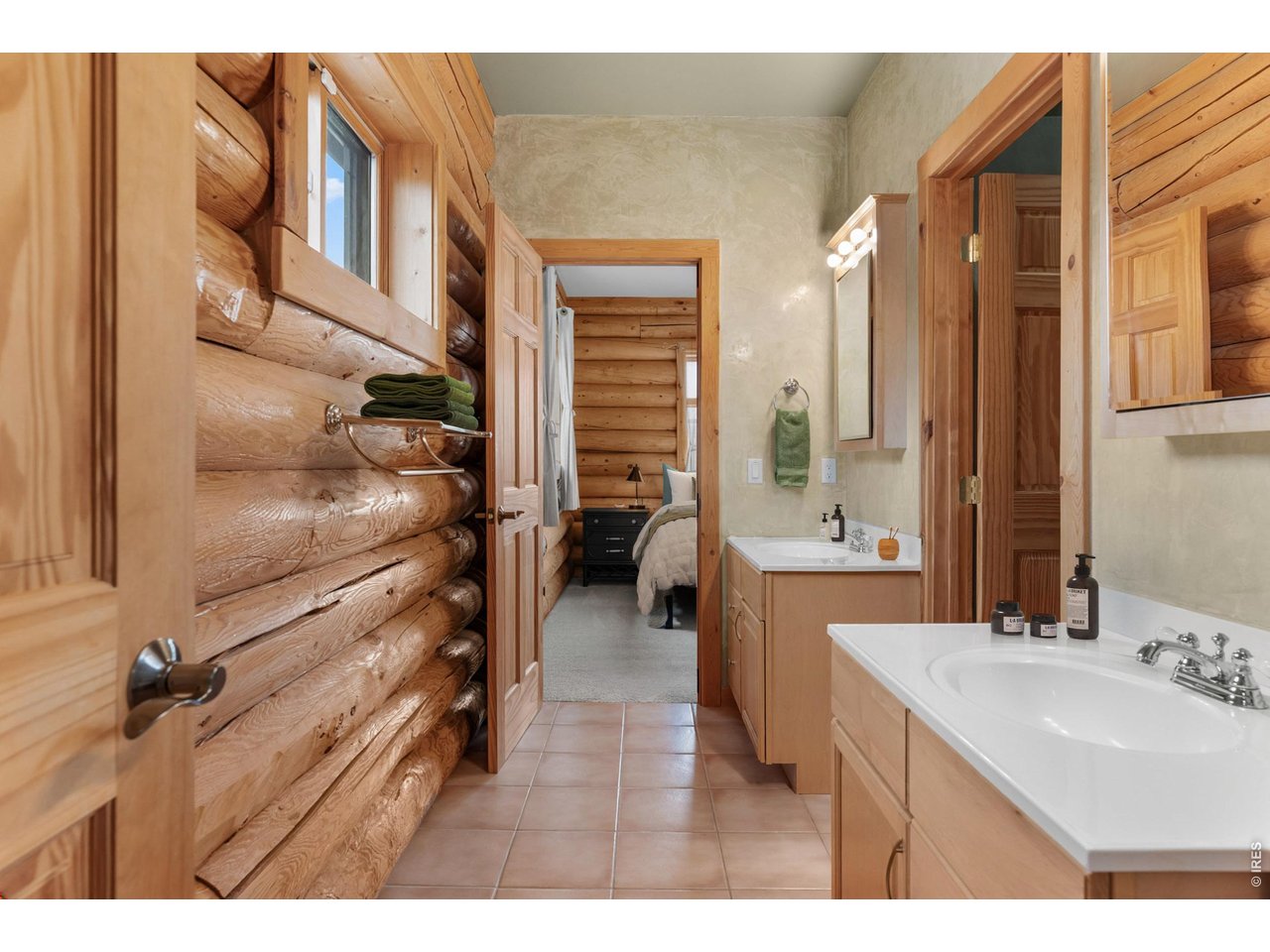 1028 Rudi Lane Golden, CO 80403 - Photo 36 of 46 a bathroom with a sink a mirror and a bathtub