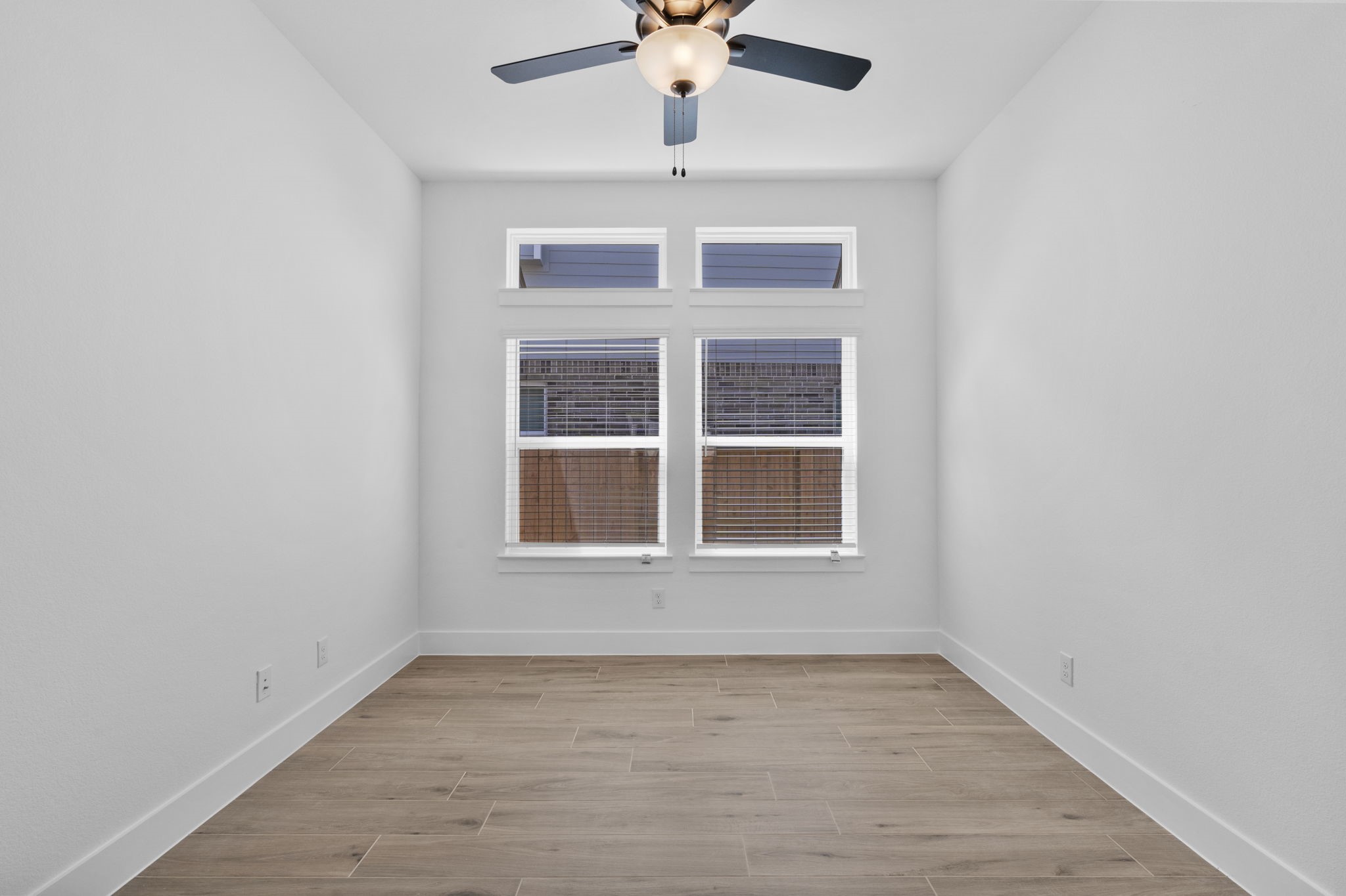 2910 Peach Vly Road Fulshear, TX 77423 - Photo 12 of 35 an empty room with a window and a ceiling fan