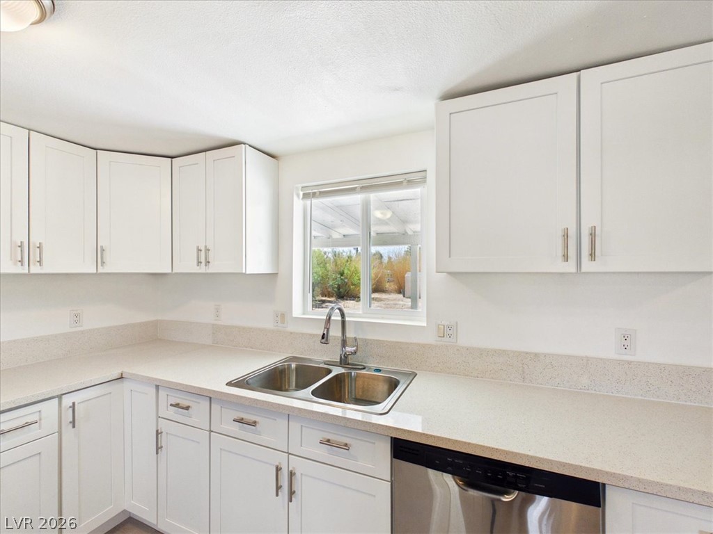 4081 Retread Road Pahrump, NV 89048 - Photo 17 of 98 A well-appointed culinary space featuring sleek cabinetry and ample counter surfaces, ideal for meal preparation and entertaining.