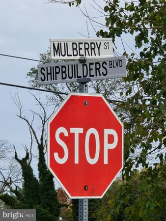 a red sign board with a sign board