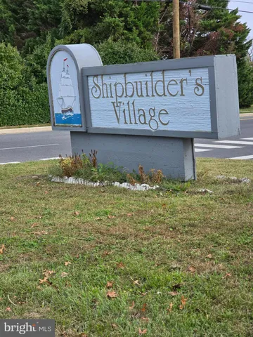 a view of outdoor space with green field and trees