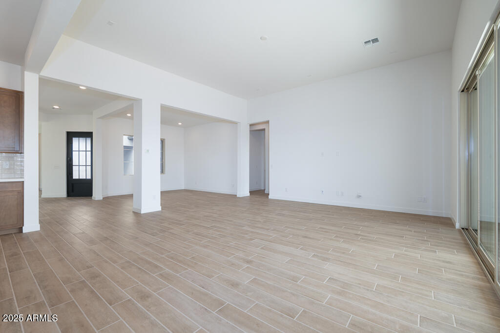 829 Golden Ore Pass Apache Junction, AZ 85120 - Photo 7 of 33 a view of a big room with wooden floor and windows