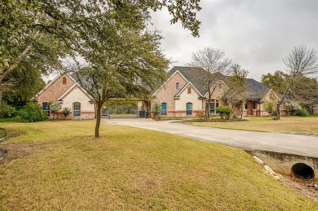 a view of a hallway with wooden floor and a chandelier