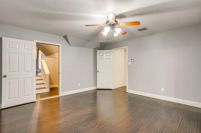 a white toilet sitting next to a bathroom sink