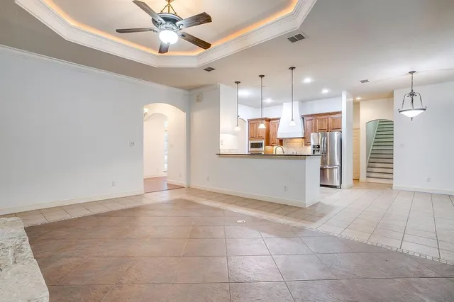a kitchen with stainless steel appliances granite countertop a sink a counter space and wooden cabinets