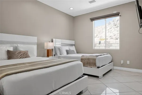 a bedroom with bed and window