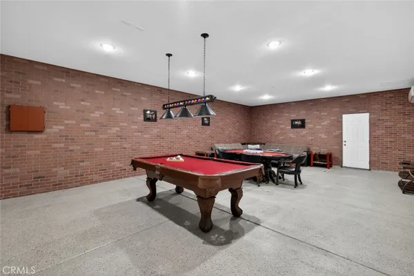 a room with furniture pool table and table