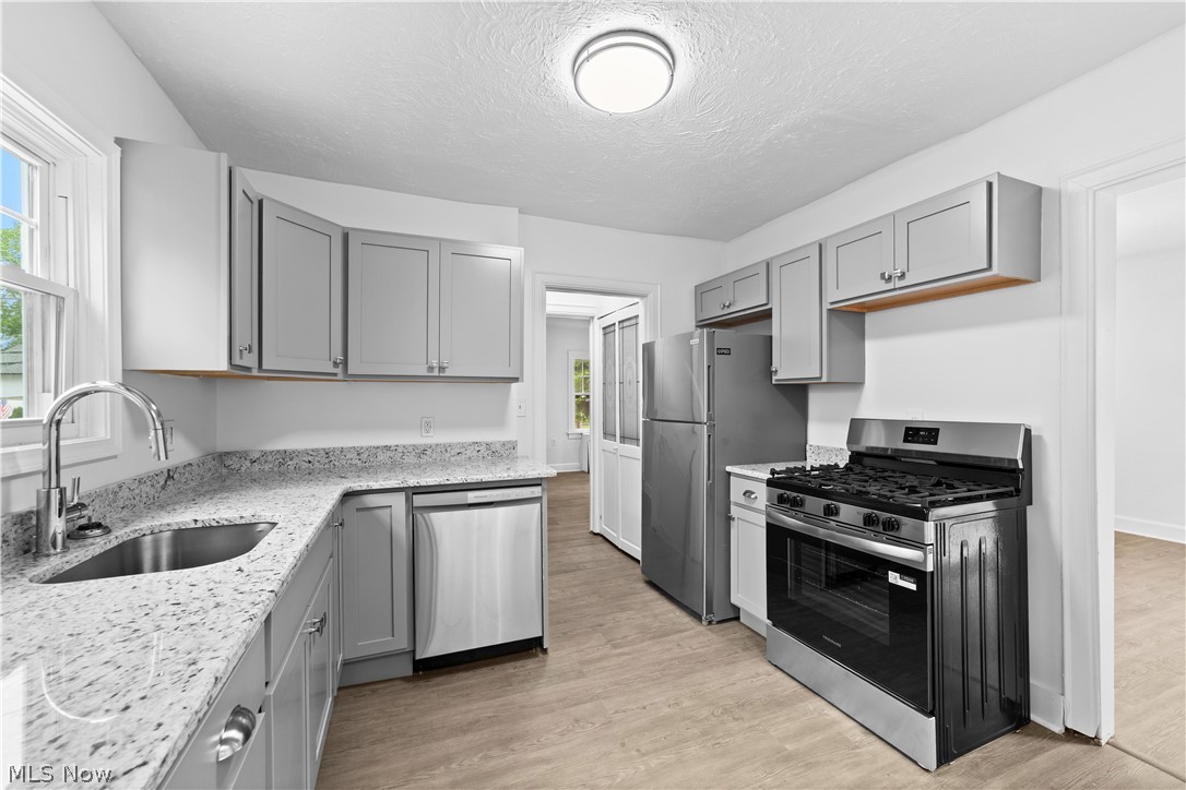 1409 Mayfield Ridge Road Mayfield Heights, OH 44124 - Photo 2 of 40 Eat-In Kitchen with granite counters and updated appliances