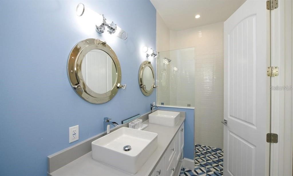 212 Spring Avenue Anna Maria, FL 34216 - Photo 13 of 31 a bathroom with a sink and a mirror