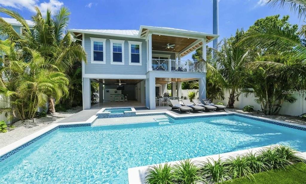 212 Spring Avenue Anna Maria, FL 34216 - Photo 28 of 31 a view of a house with a yard and sitting area