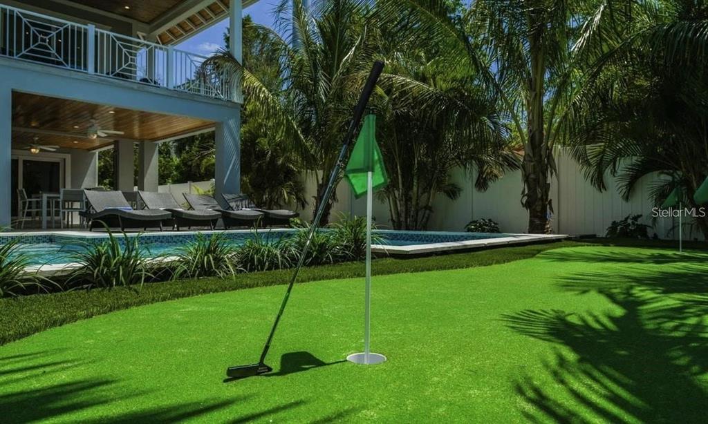 212 Spring Avenue Anna Maria, FL 34216 - Photo 30 of 31 a view of a house with a backyard