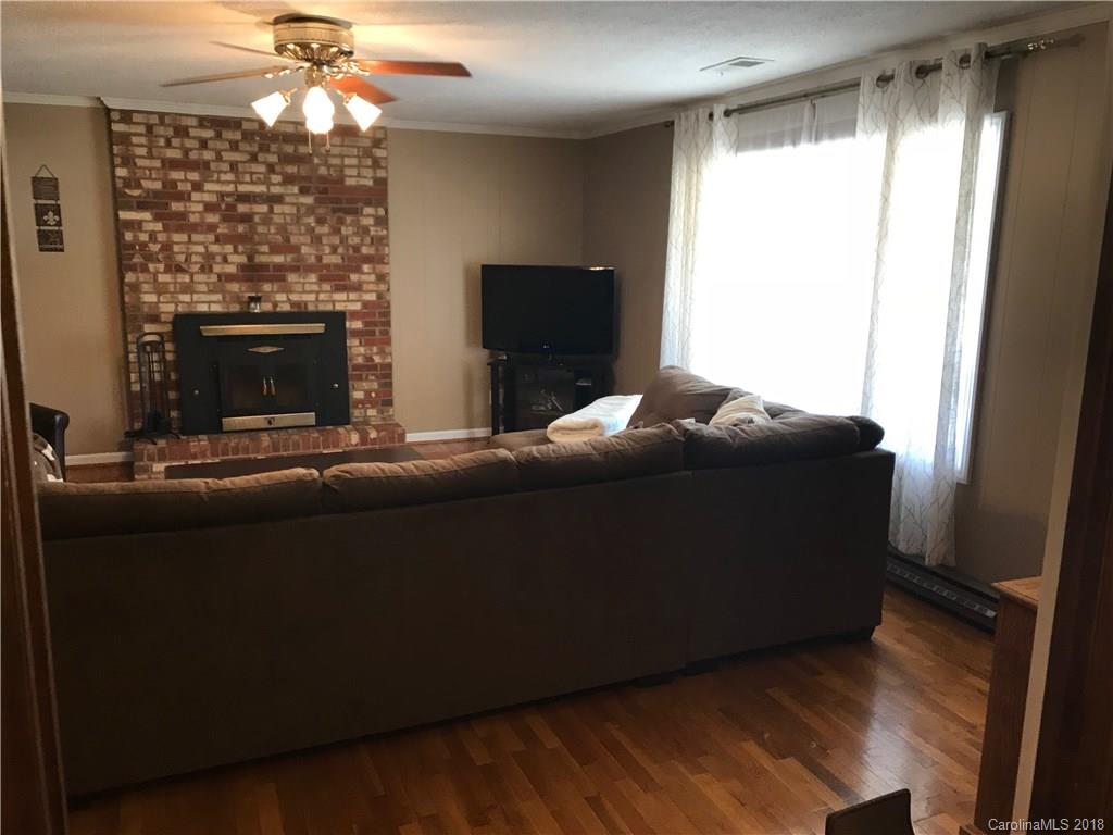 628 Loray Farm Road Dallas, NC 28034 - Photo 11 of 35 a living room with furniture and a fireplace