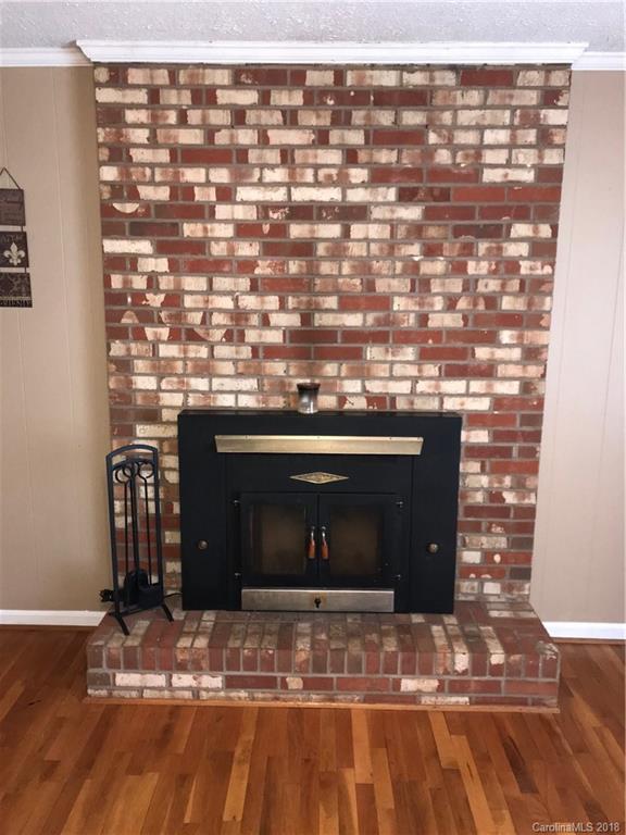 628 Loray Farm Road Dallas, NC 28034 - Photo 13 of 35 a view of fireplace and wooden floor