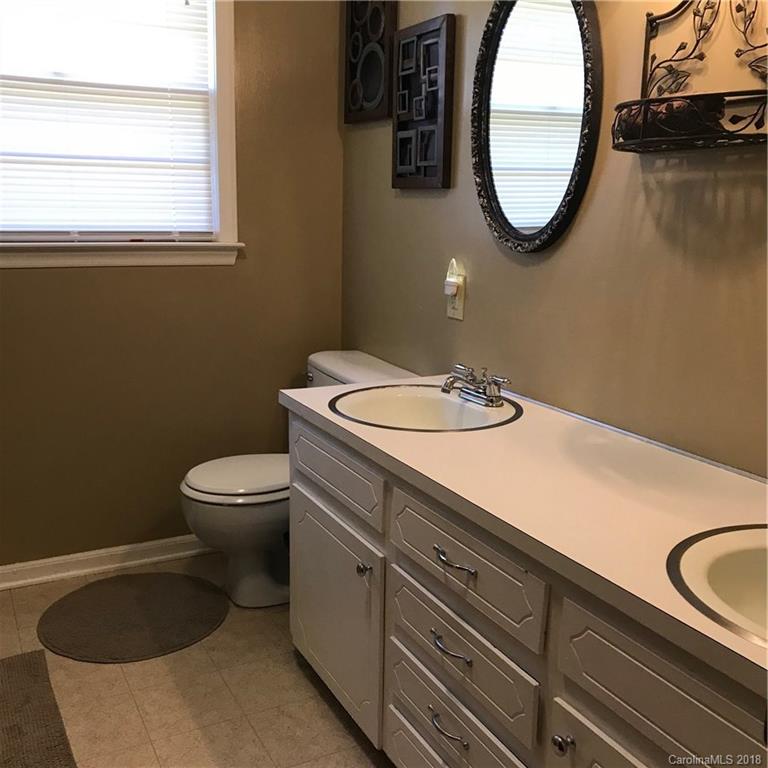 628 Loray Farm Road Dallas, NC 28034 - Photo 16 of 35 a bathroom with a sink and a mirror