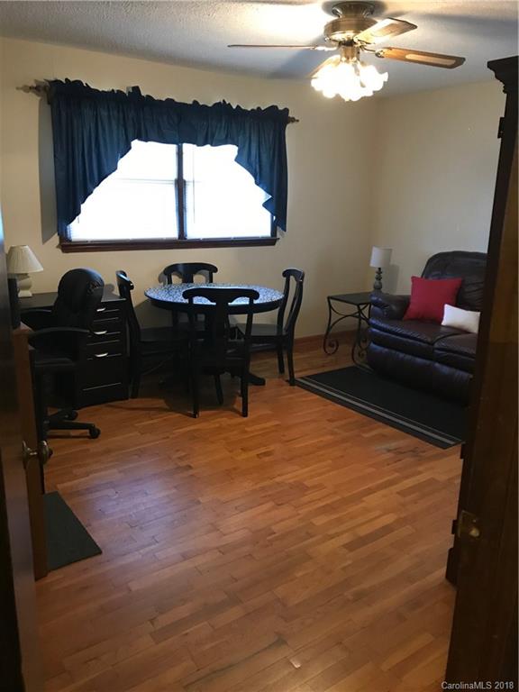 628 Loray Farm Road Dallas, NC 28034 - Photo 23 of 35 a room with a table chairs and a window