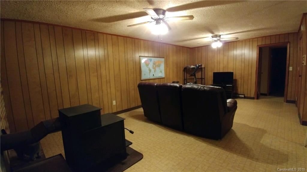 628 Loray Farm Road Dallas, NC 28034 - Photo 29 of 35 a living room with furniture and a mirror