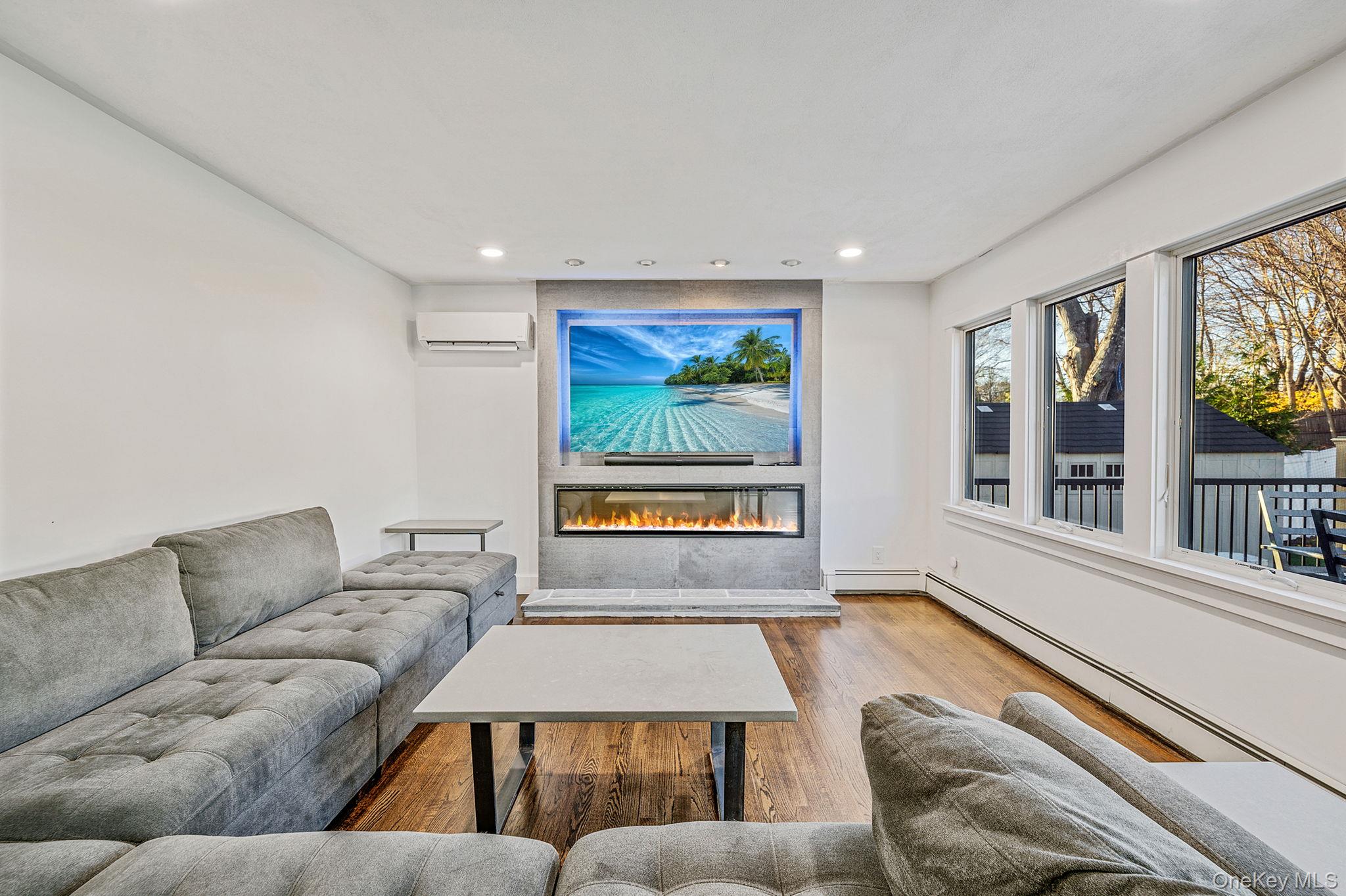 11 Chivalry Lane Nesconset, NY 11767 - Photo 14 of 35 a living room with furniture and a large window