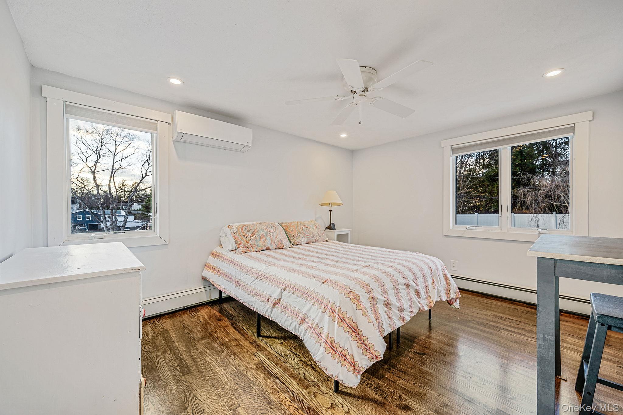 11 Chivalry Lane Nesconset, NY 11767 - Photo 19 of 35 a bedroom with a large bed and a window