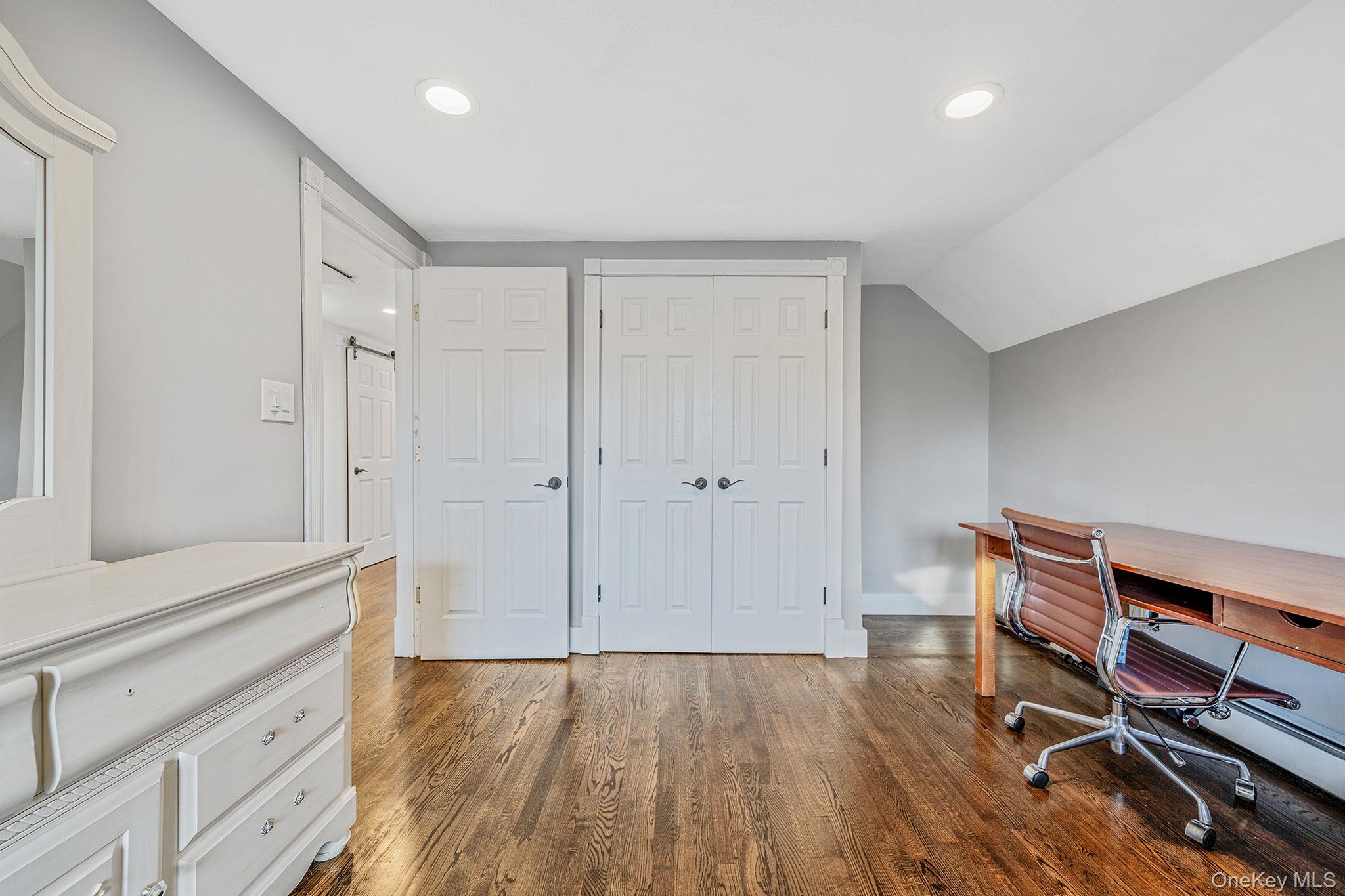 11 Chivalry Lane Nesconset, NY 11767 - Photo 21 of 35 a view of room with wooden floor and fan