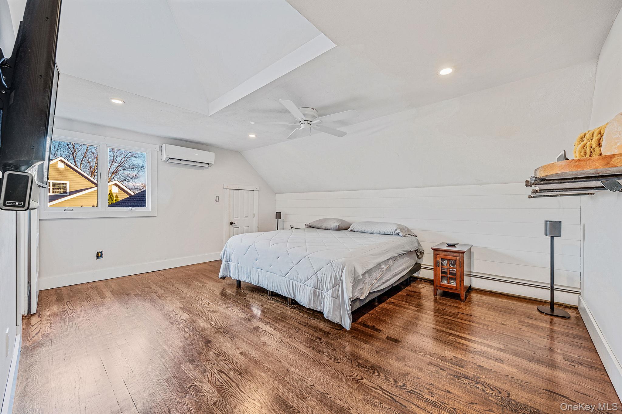 11 Chivalry Lane Nesconset, NY 11767 - Photo 26 of 35 a bedroom with a bed and wooden floor