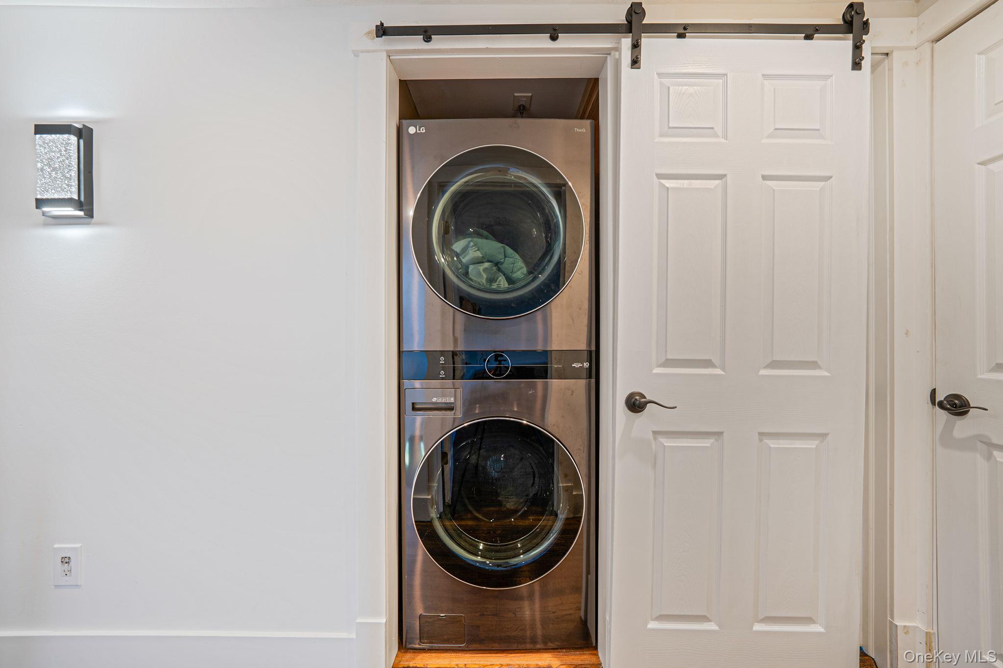 11 Chivalry Lane Nesconset, NY 11767 - Photo 28 of 35 a view of a hallway with washer and dryer