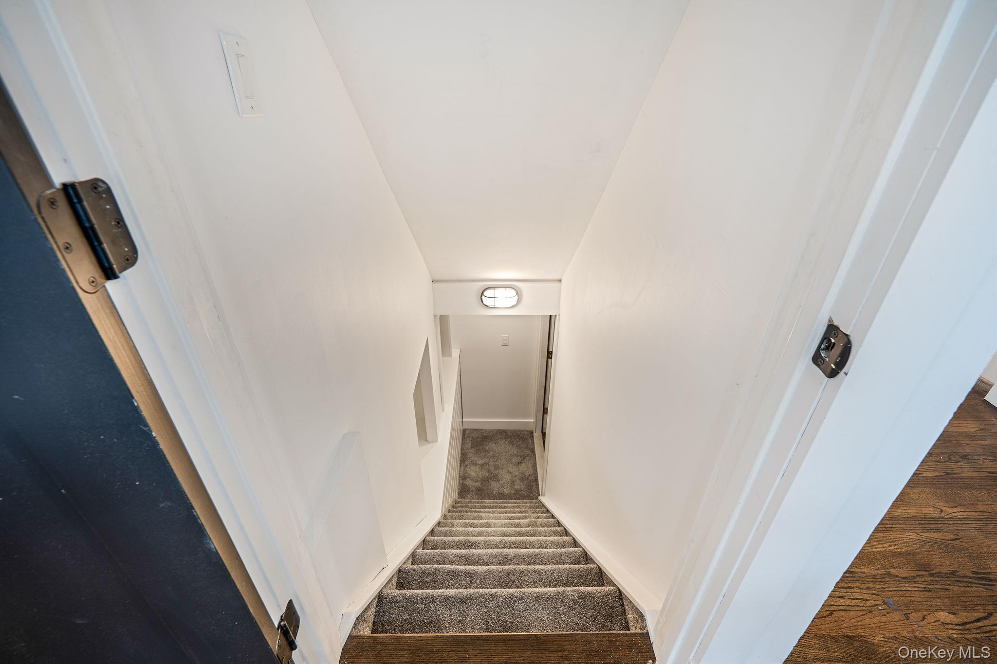 11 Chivalry Lane Nesconset, NY 11767 - Photo 29 of 35 a view of a hallway with wooden floor and entryway