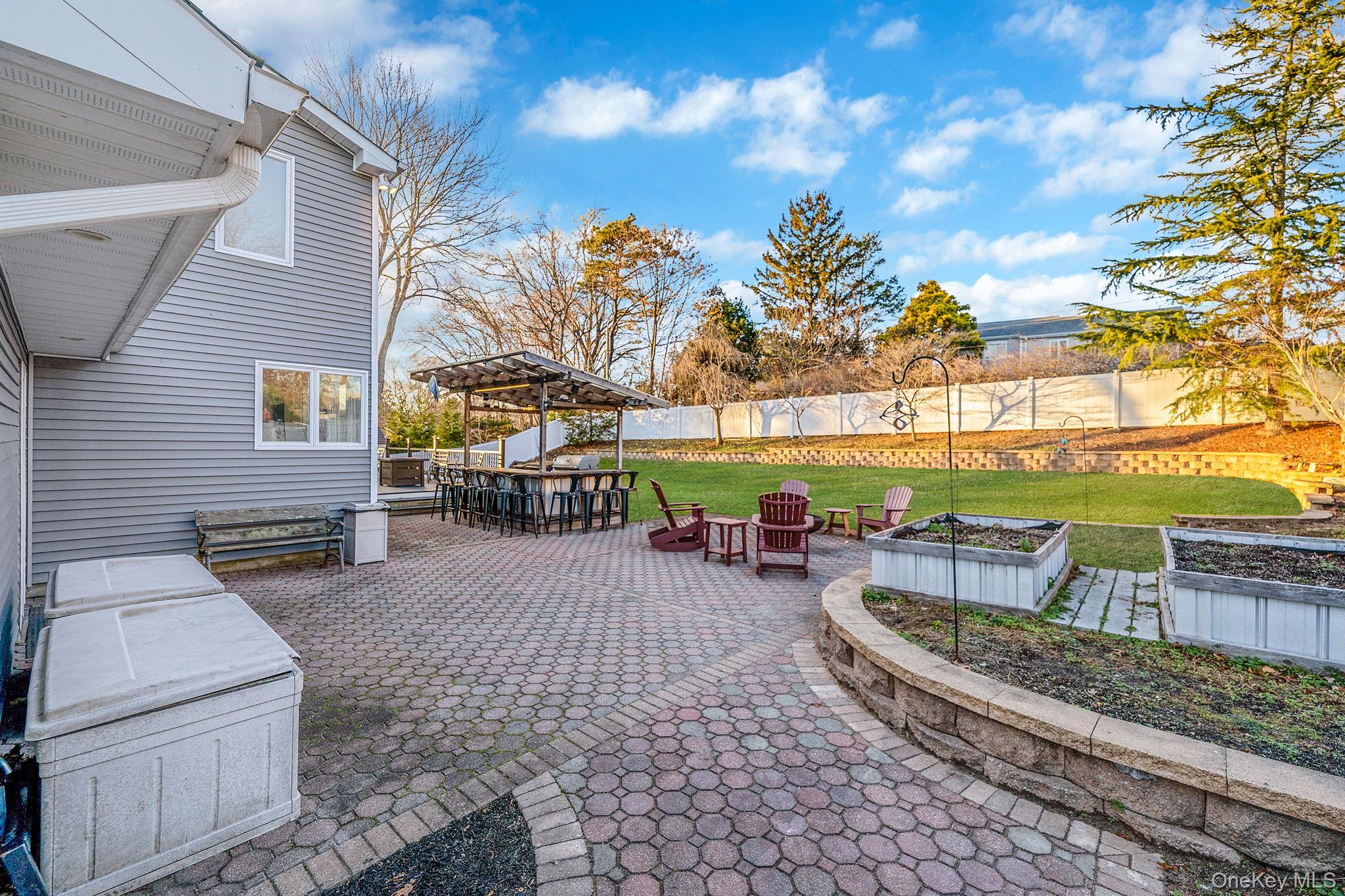 11 Chivalry Lane Nesconset, NY 11767 - Photo 32 of 35 a view of a roof deck with couches and wooden floor