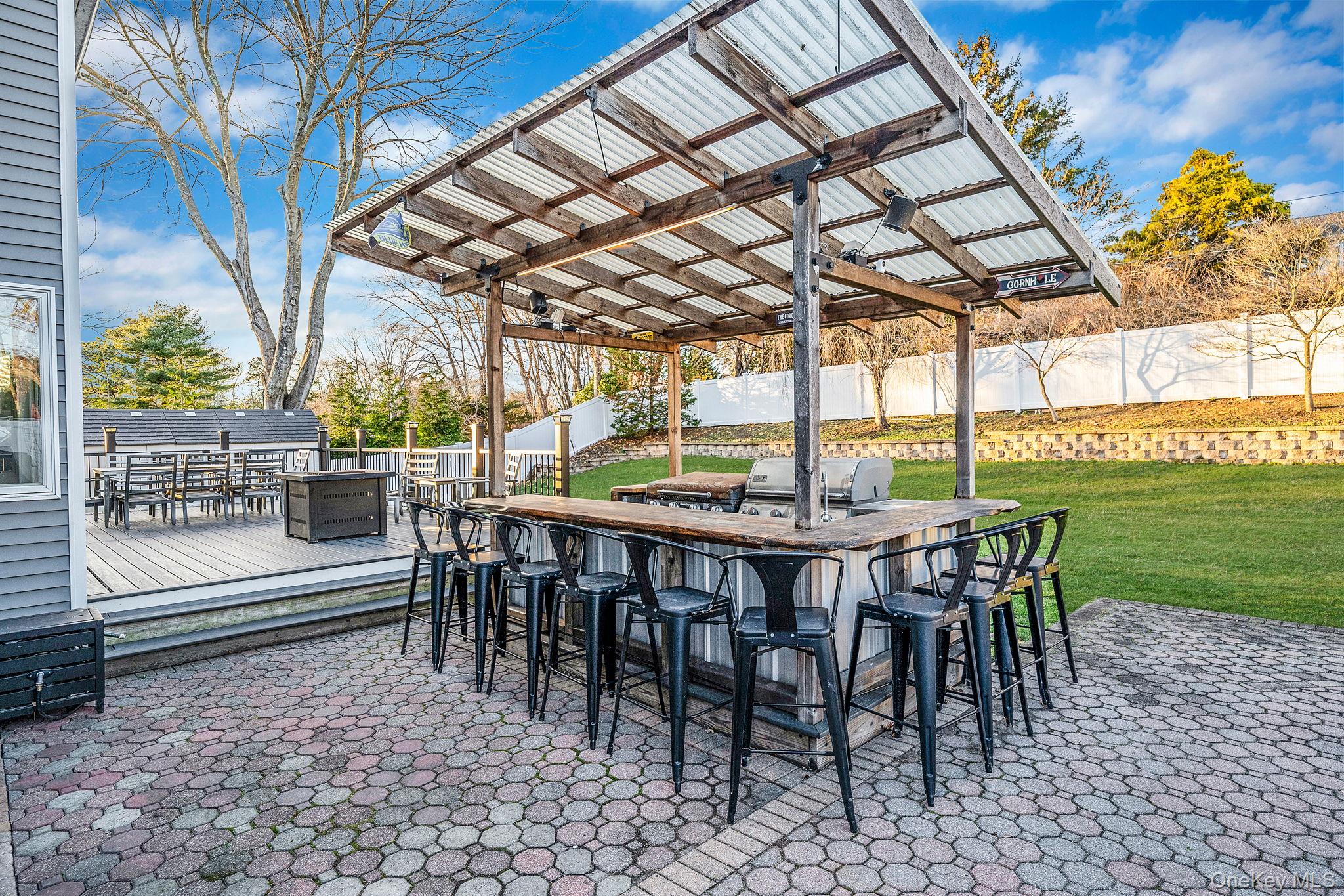 11 Chivalry Lane Nesconset, NY 11767 - Photo 33 of 35 a view of a patio with a table chairs and garden