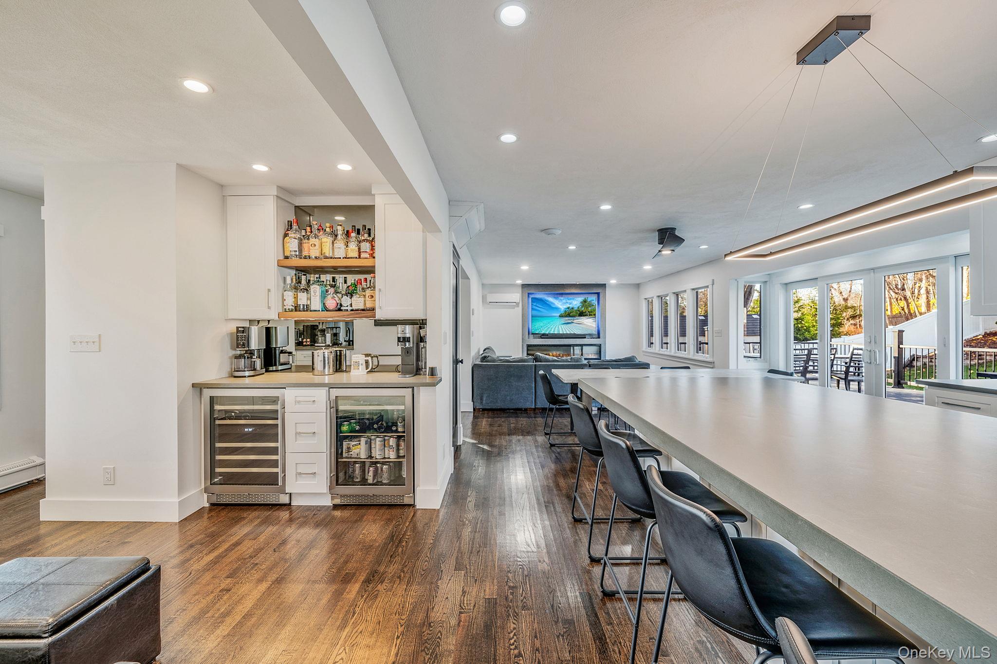 11 Chivalry Lane Nesconset, NY 11767 - Photo 7 of 35 a kitchen with kitchen island white cabinets and stainless steel appliances