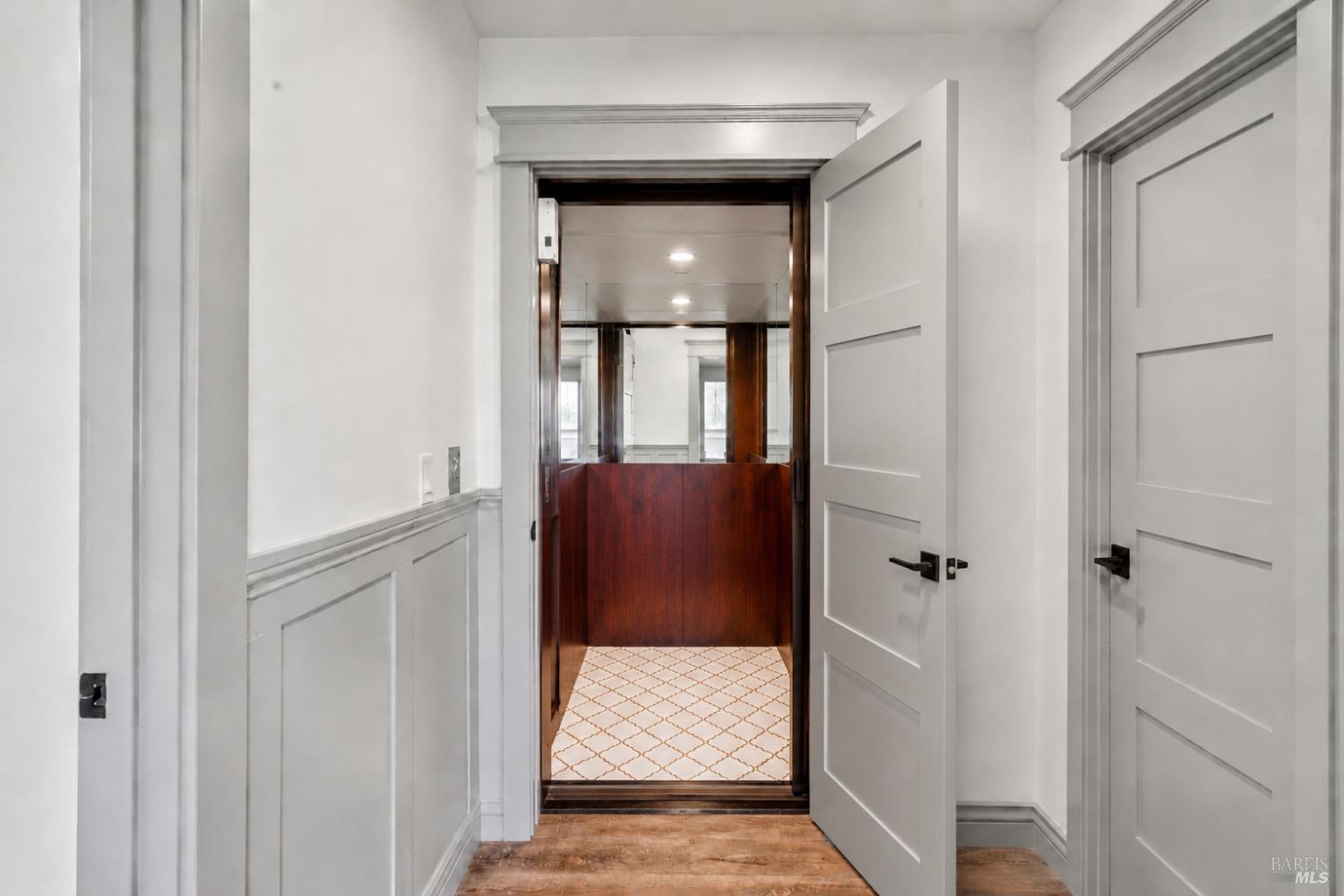 88 Cypress Loop Bodega Bay, CA 94923 - Photo 10 of 88 Custom Wiltek Hydraulic Elevator elevator complete with mirrored walls, recessed ceiling light, and decorative tile flooring. Perfect for residents or guests with limited mobility.