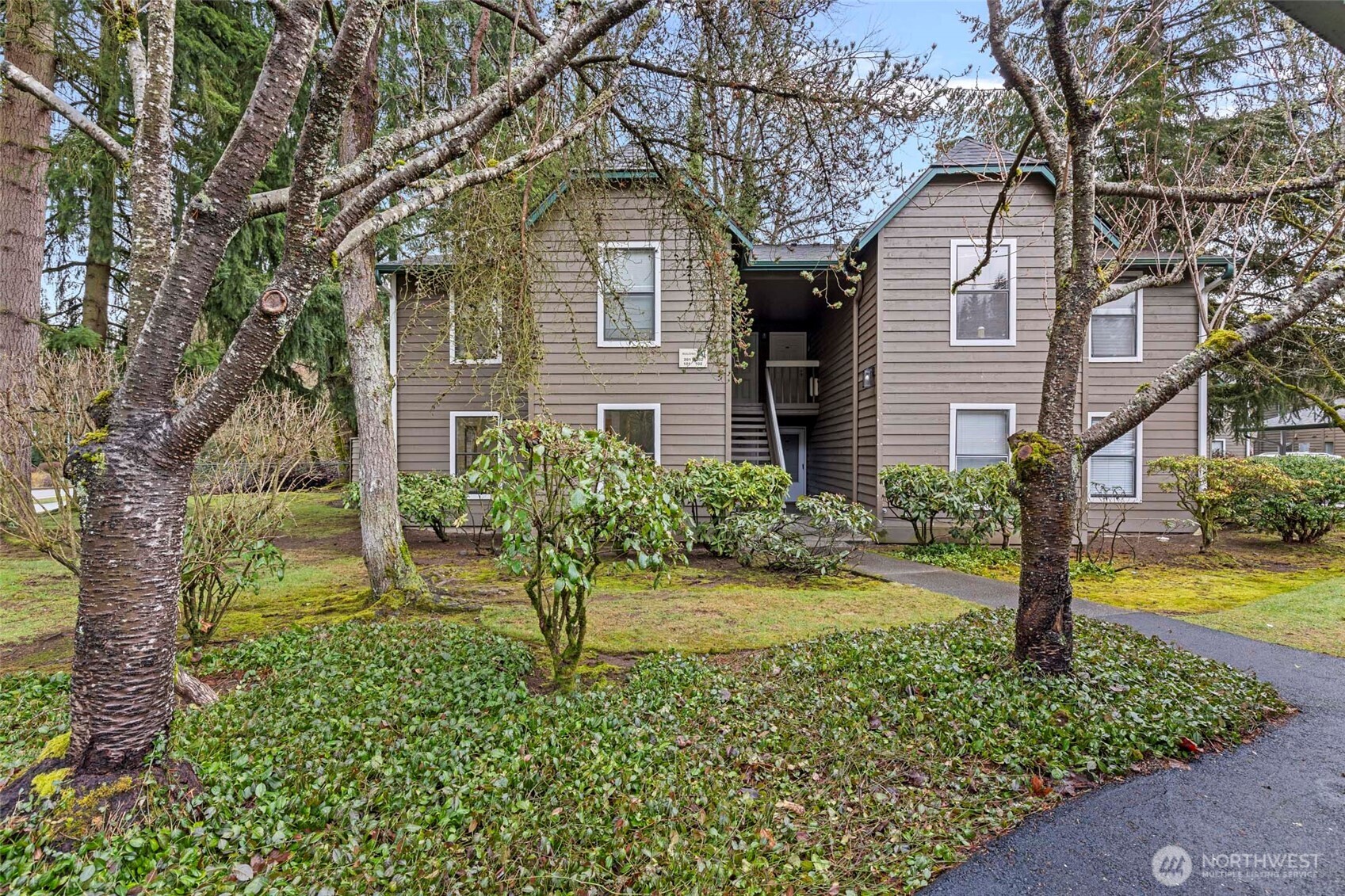 13801 Old Redmond Road, Unit A101 Redmond, WA 98052 - Photo 1 of 37 a front view of a house with a yard