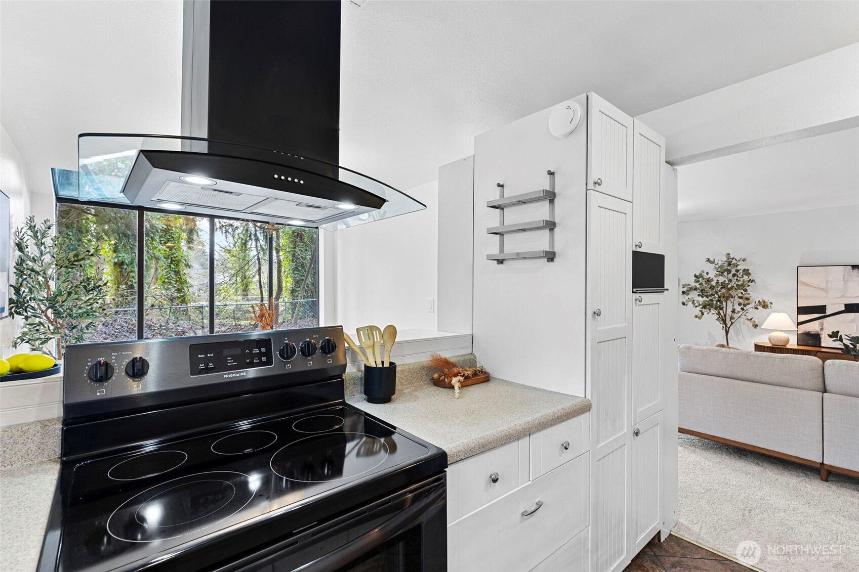 13801 Old Redmond Road, Unit A101 Redmond, WA 98052 - Photo 17 of 37 a kitchen with a stove and white cabinets