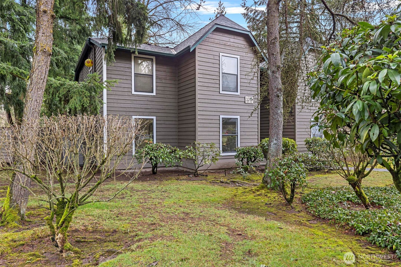 13801 Old Redmond Road, Unit A101 Redmond, WA 98052 - Photo 2 of 37 a front view of a house with garden
