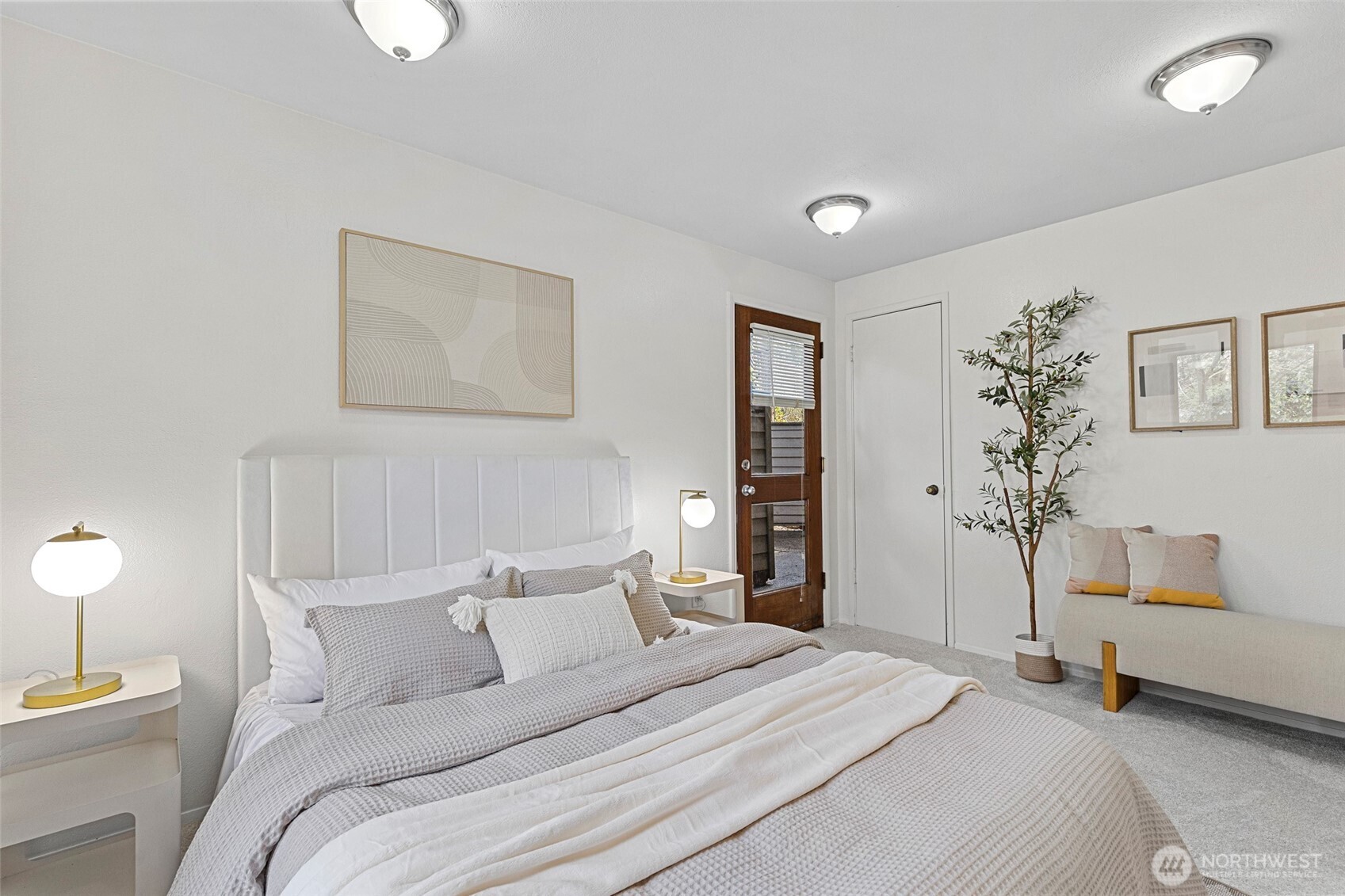 13801 Old Redmond Road, Unit A101 Redmond, WA 98052 - Photo 25 of 37 a bedroom with a bed and a potted plant