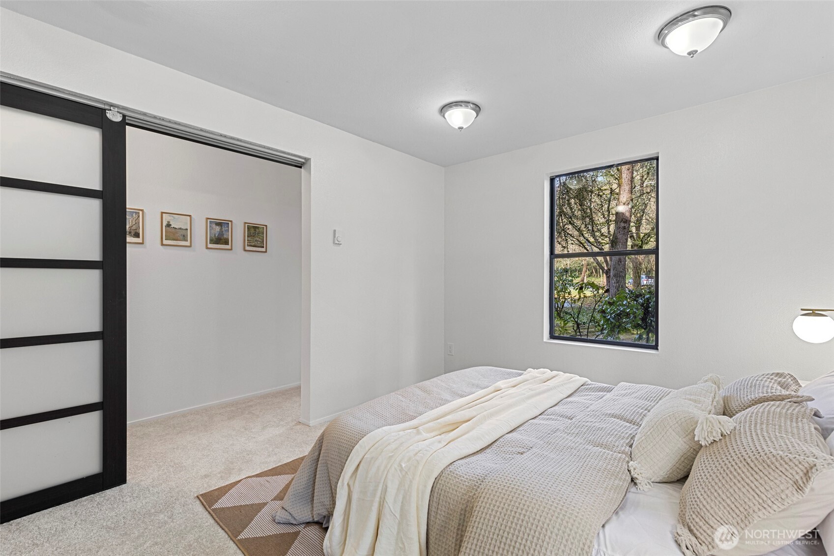 13801 Old Redmond Road, Unit A101 Redmond, WA 98052 - Photo 27 of 37 a bedroom with a bed and a window