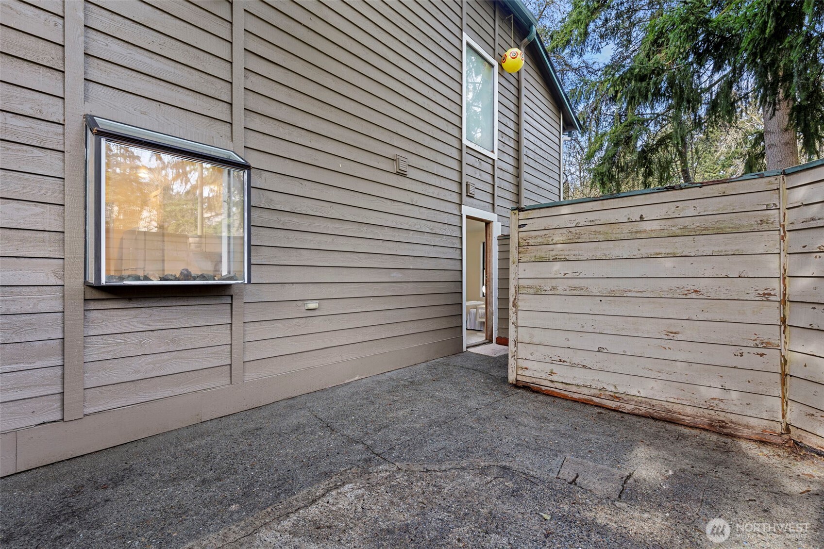 13801 Old Redmond Road, Unit A101 Redmond, WA 98052 - Photo 33 of 37 a view of a house with a large window and a garage