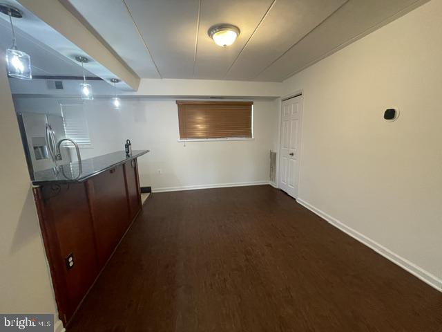 3346 Hewitt Avenue, Unit 11A Silver Spring, MD 20906 - Photo 16 of 16 an empty room with wooden floor and windows