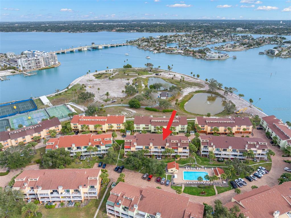 529 Sandy Hook Road Treasure Island, FL 33706 - Photo 46 of 55 an aerial view of lake and residential houses with outdoor space