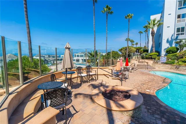 a view of a backyard with sitting area