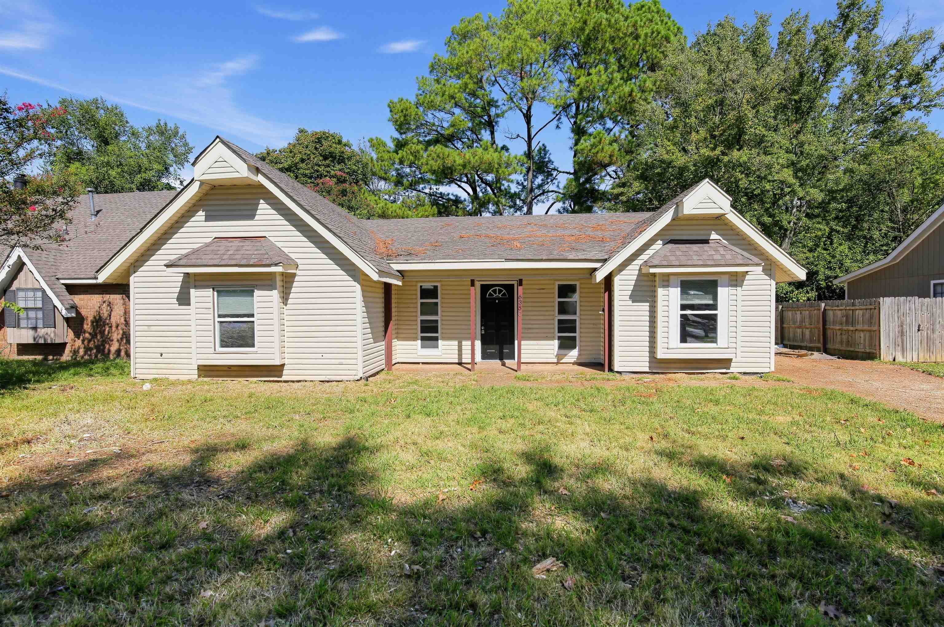 6350 Midsummer Way Memphis, TN 38115 - Photo 2 of 21 Charming single-story residence featuring a brick and siding exterior with dual gabled rooflines and a covered front entry