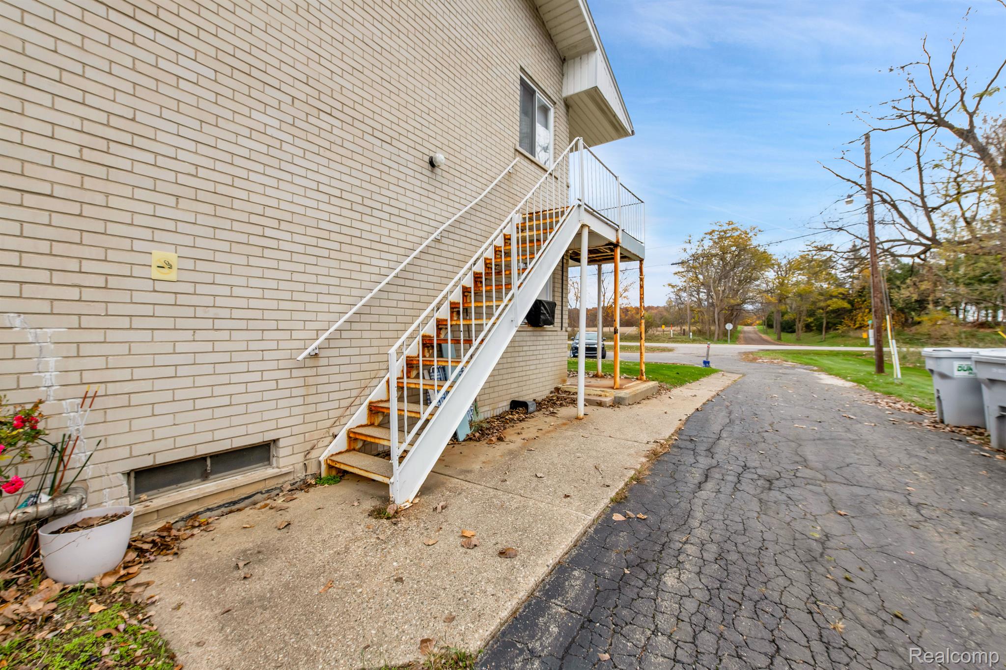 26945 Milford Road, Unit 2 New Hudson, MI 48165 - Photo 16 of 29 Side stairwell for quick