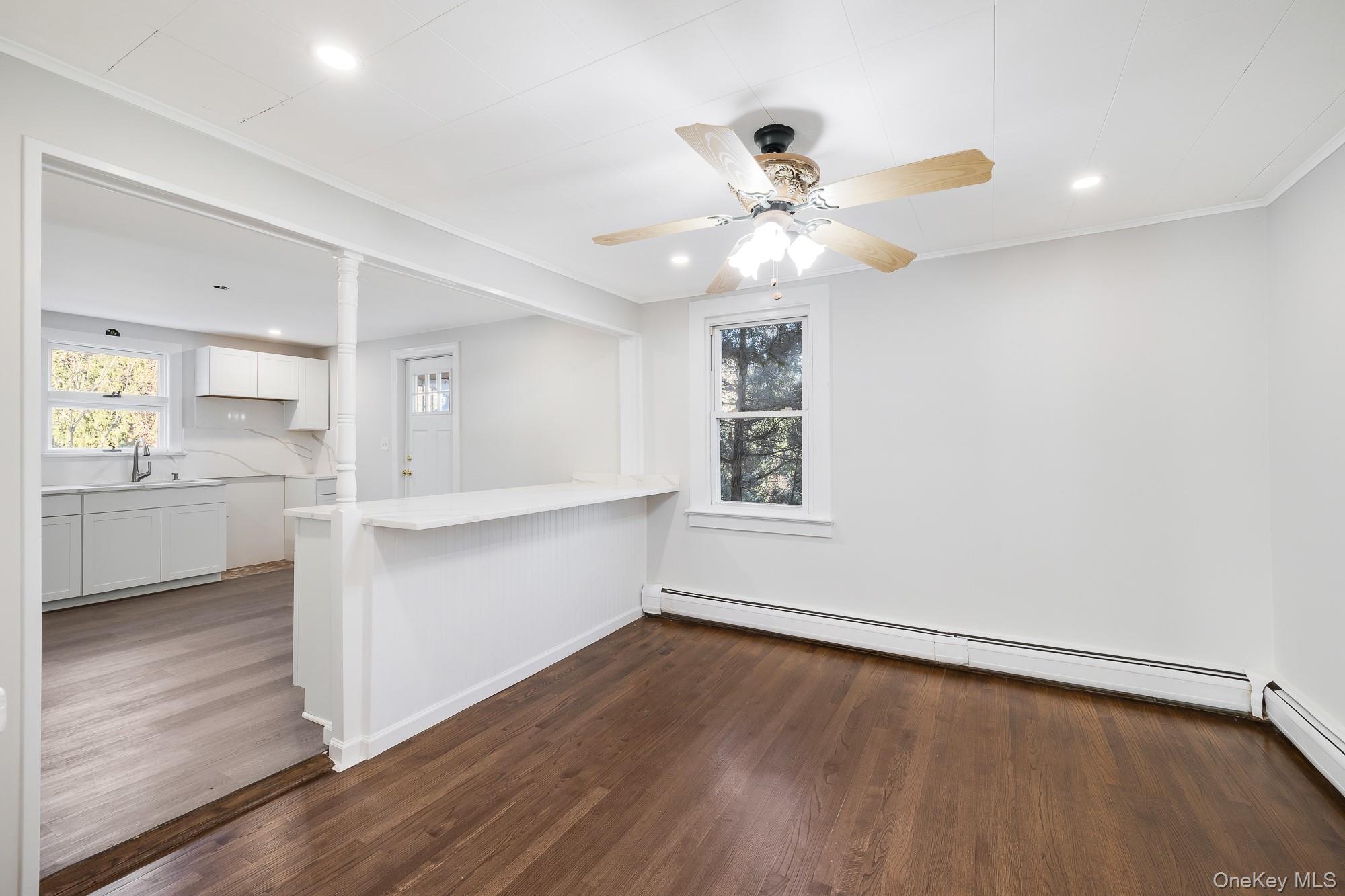 122 Rosman Road Thiells, NY 10984 - Photo 13 of 30 a view of an empty room with a window and wooden floor