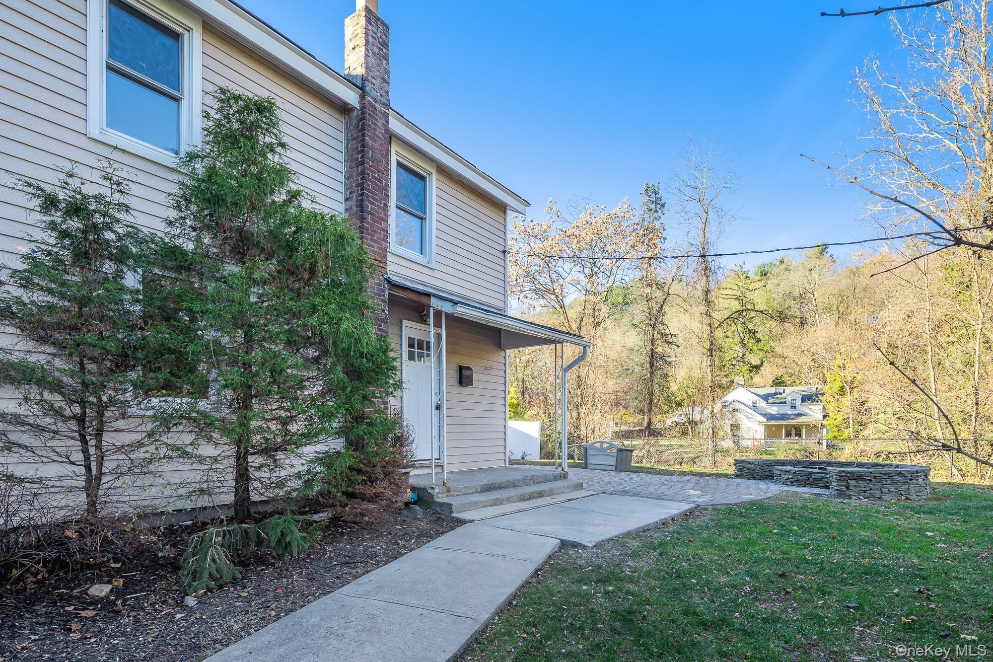 122 Rosman Road Thiells, NY 10984 - Photo 26 of 30 a front view of a house with garden