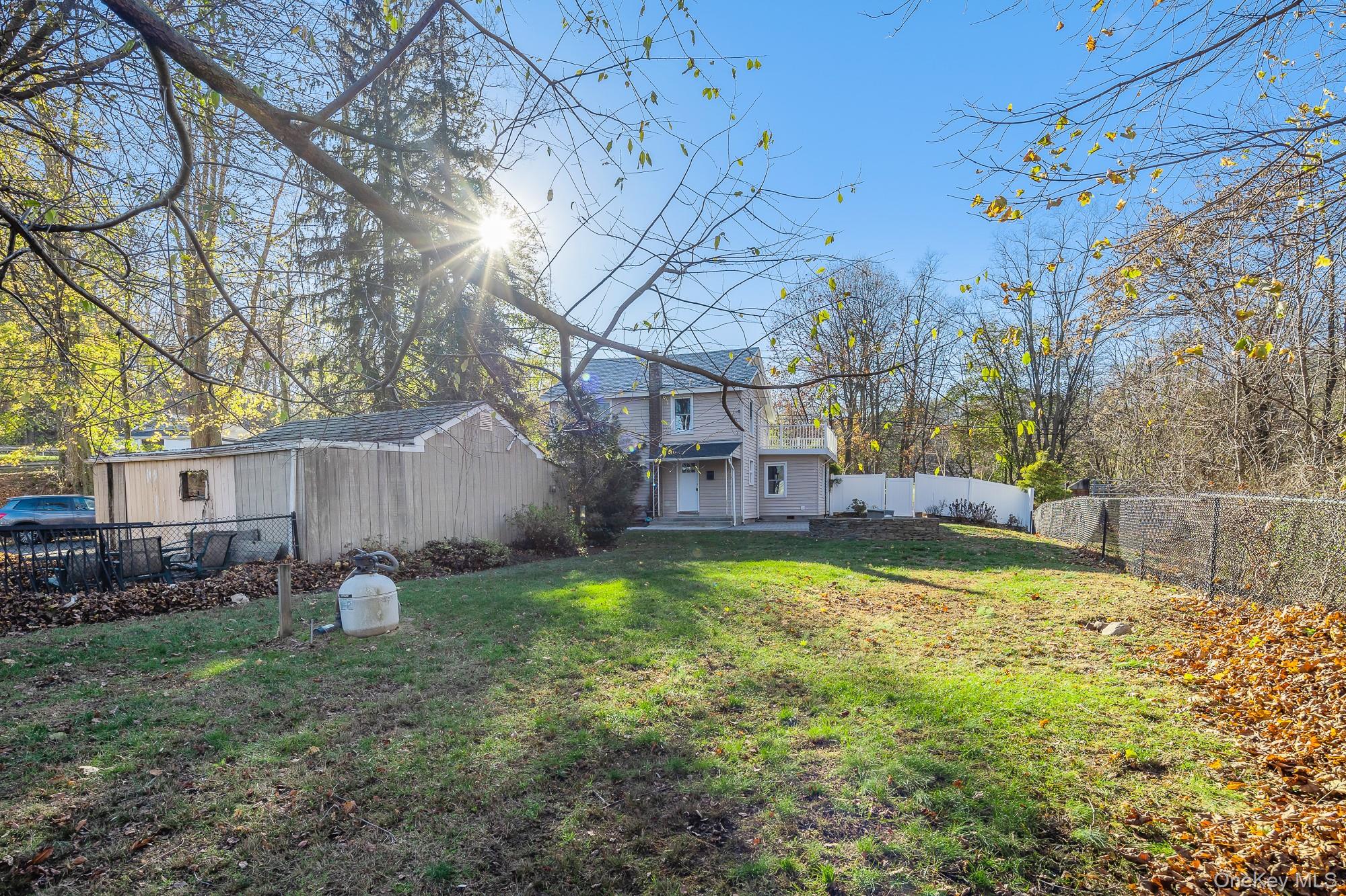 122 Rosman Road Thiells, NY 10984 - Photo 27 of 30 a backyard of a house with lots of green space
