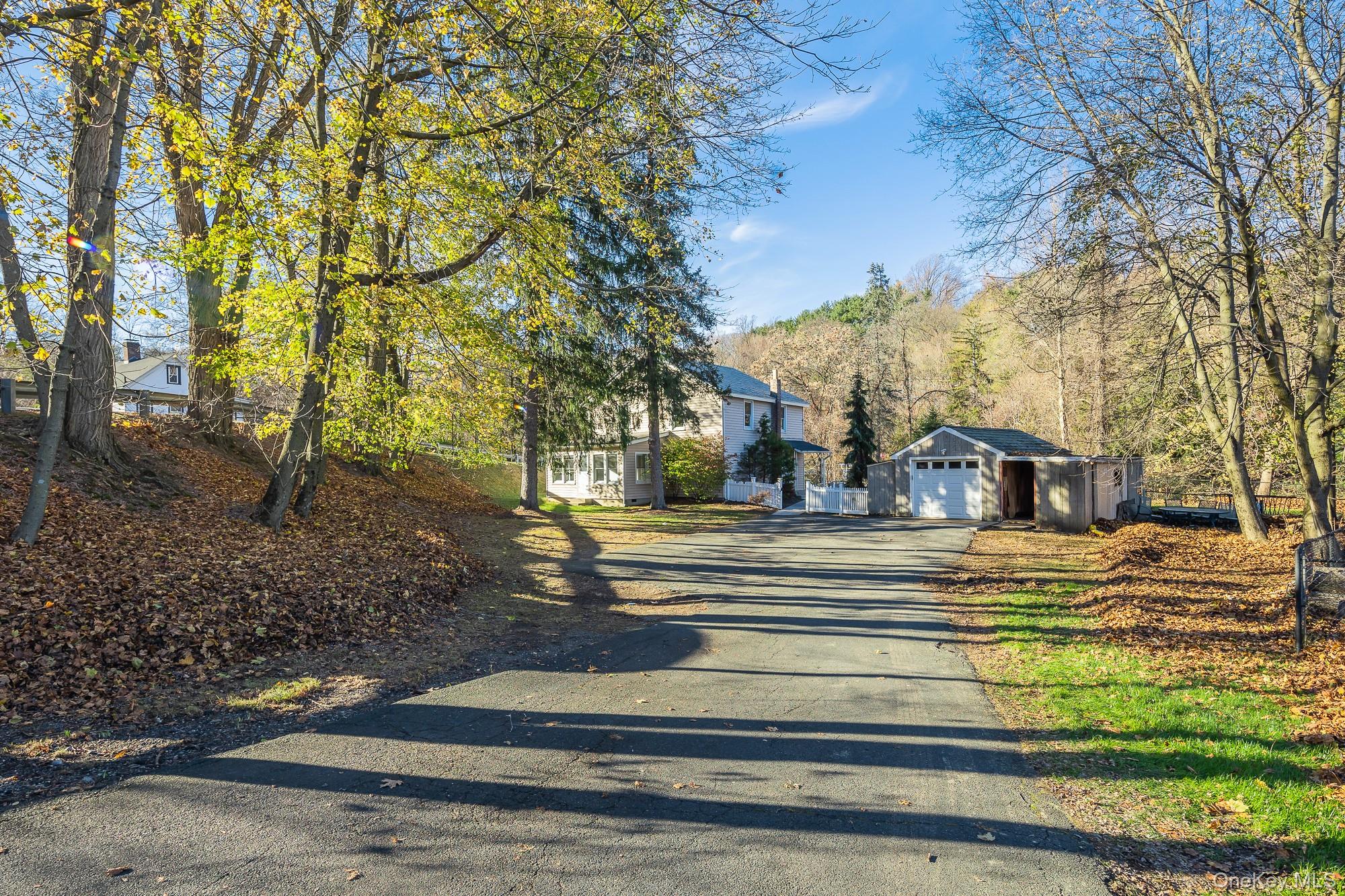 122 Rosman Road Thiells, NY 10984 - Photo 30 of 30 a view of a house with a yard and large tree