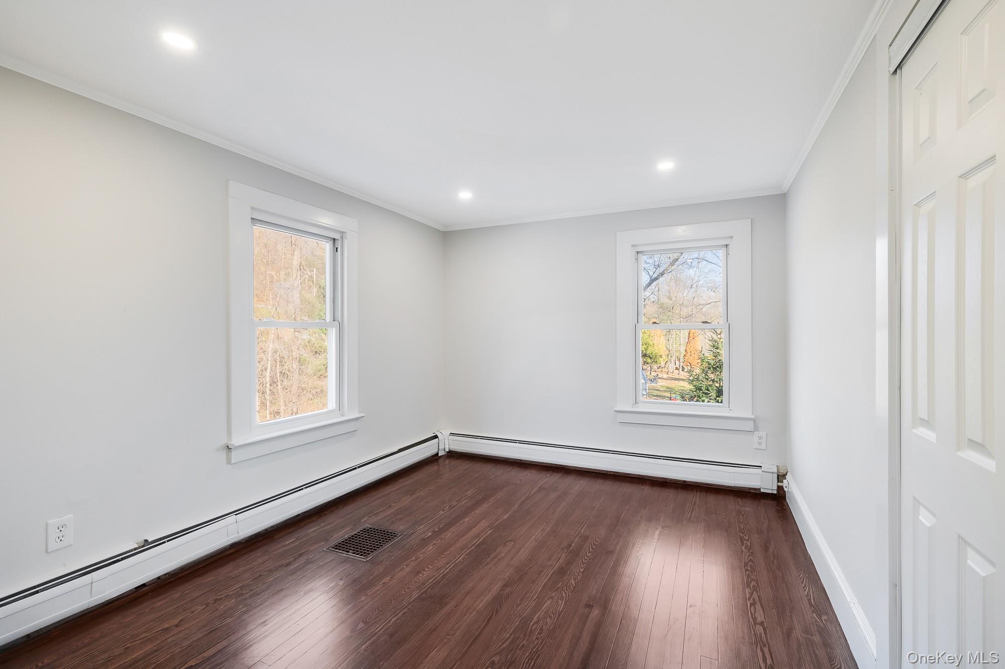 122 Rosman Road Thiells, NY 10984 - Photo 6 of 30 an empty room with window and wooden floor