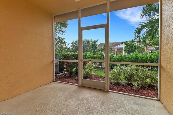 an empty room with balcony and outdoor space