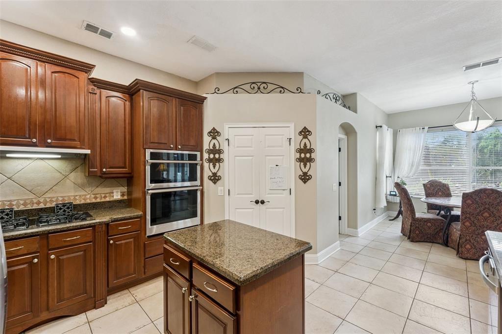 216 Juniper Ridge Court Sanford, FL 32771 - Photo 16 of 61 a kitchen with cabinets and window