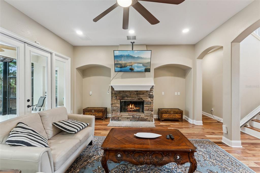 216 Juniper Ridge Court Sanford, FL 32771 - Photo 19 of 61 a living room with furniture and a fireplace