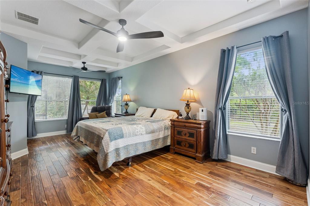 216 Juniper Ridge Court Sanford, FL 32771 - Photo 20 of 61 a bedroom with a bed and a flat tv screen on dresser